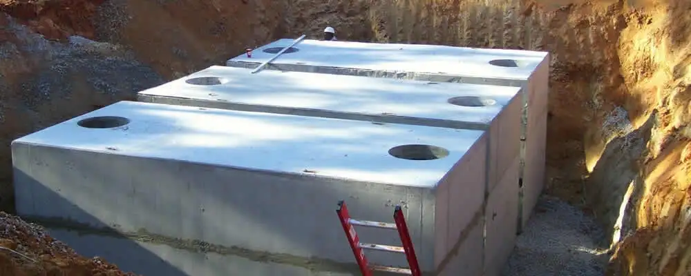 Septic tank installation site with a newly placed concrete tank in Troy, MI